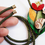 Laliblue : Plant Lover : Flower and snail bolo necklace